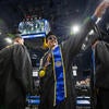Graduate waving to crowd
